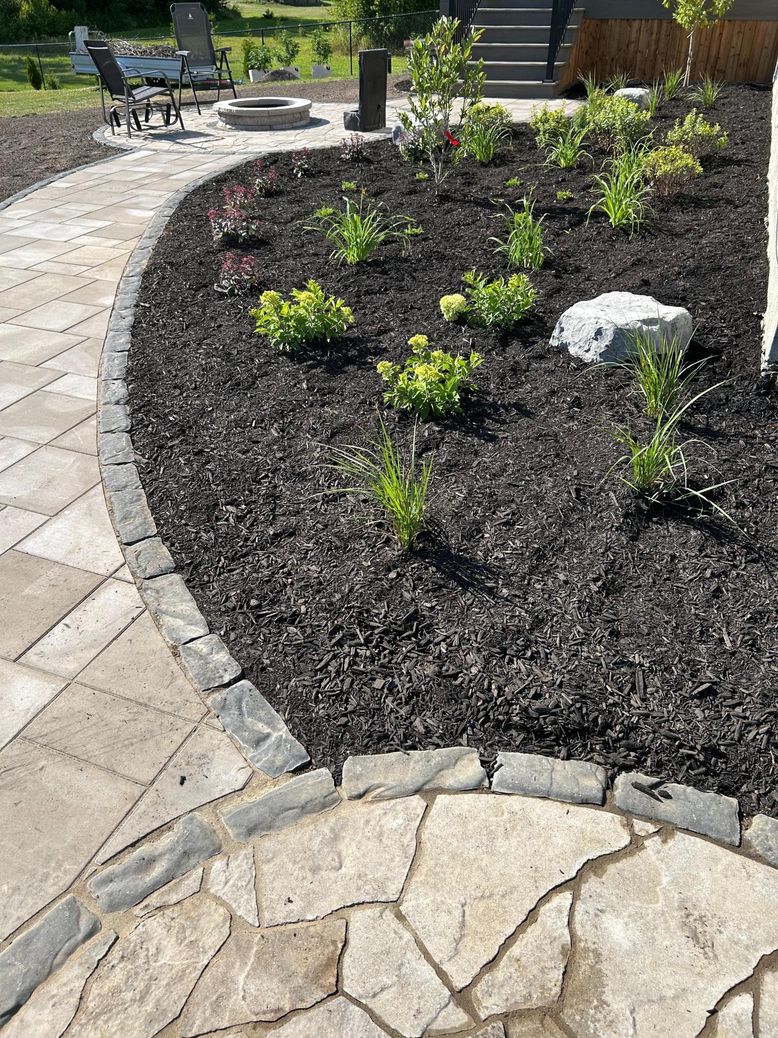 8F493601-74D2-453B-ACF6-63BEBDDF634B Ottawa landscaper trimming hedges with electric trimmer for clean finish