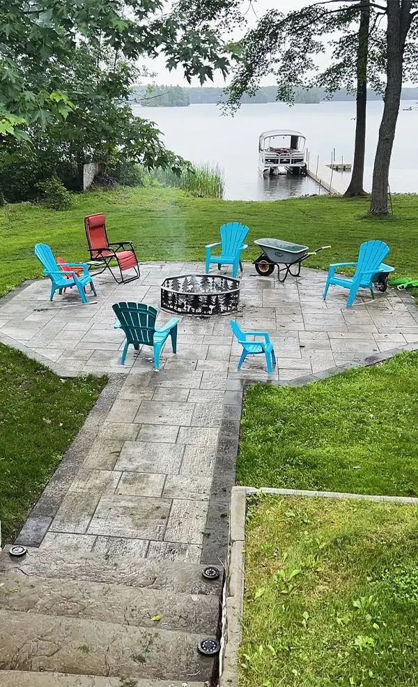 Custom built-in fire pit installation in an Ottawa backyard by KJ Landscape & Design