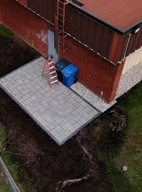 Completed Metcalfe retaining walls project stabilizing a sloped backyard