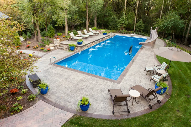 Custom Pool Construction Ottawa – completed pool and paver deck by KJ Landscape & Design.