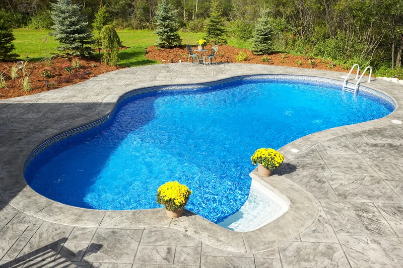 Inground Pool Construction Ottawa – finished pool with stamped concrete patio.